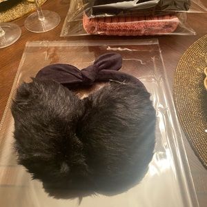 New in Packaging. Women’s Black Faux Fur Earmuffs with a Bow.